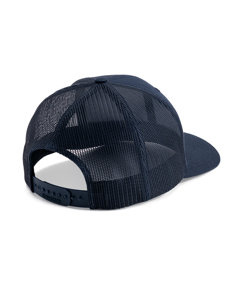 Navy trucker hat with mesh back and adjustable snapback closure shown from the rear angle.