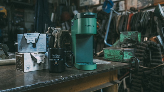 Crockett K Cup coffee in packaging next to a green Keurig.