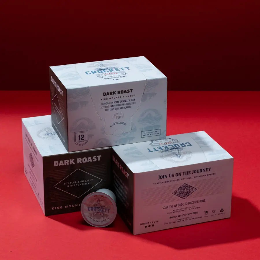 Coffee subscription featuring Crockett Coffee dark roast pods in stylish packaging, set against a bold red background.