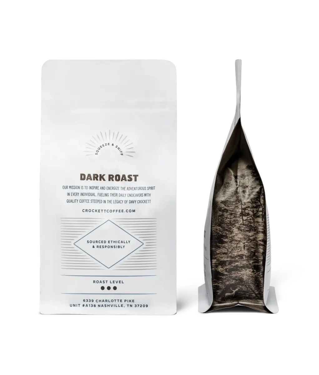 American made coffee brands like Crockett Coffee feature dark roast whole bean bags with forest-themed packaging.