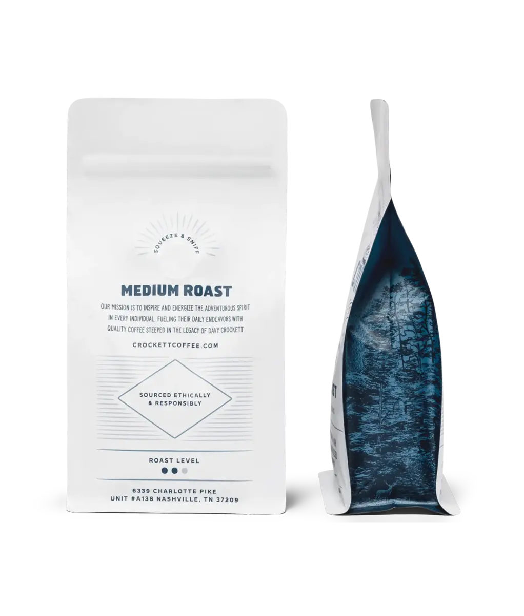 American made coffee medium roast bag from Crockett Coffee with forest artwork on the side panel.