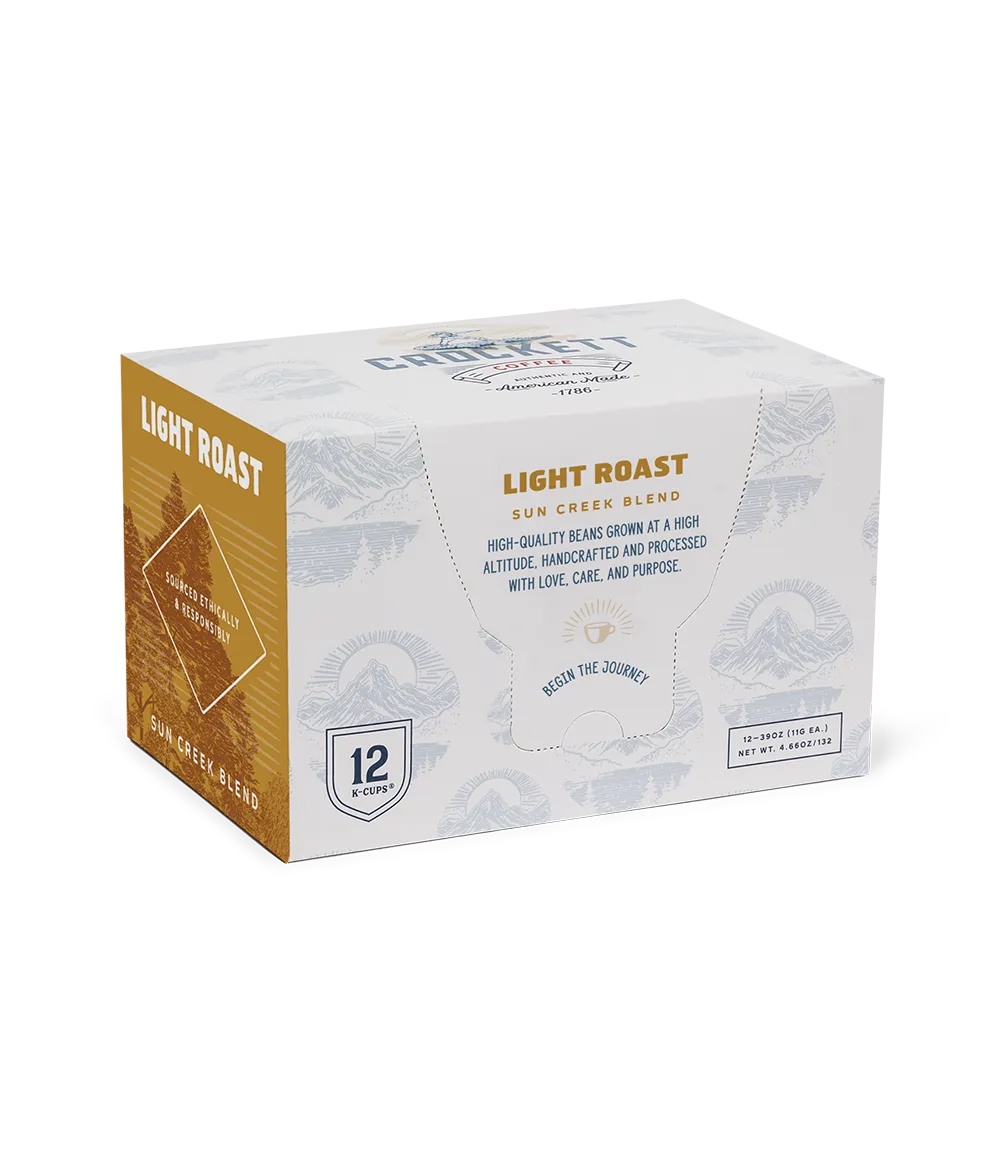 Light roast coffee pods in a 12-count box of Crockett Coffee's Sun Creek Blend made with high-altitude, ethically sourced beans.
