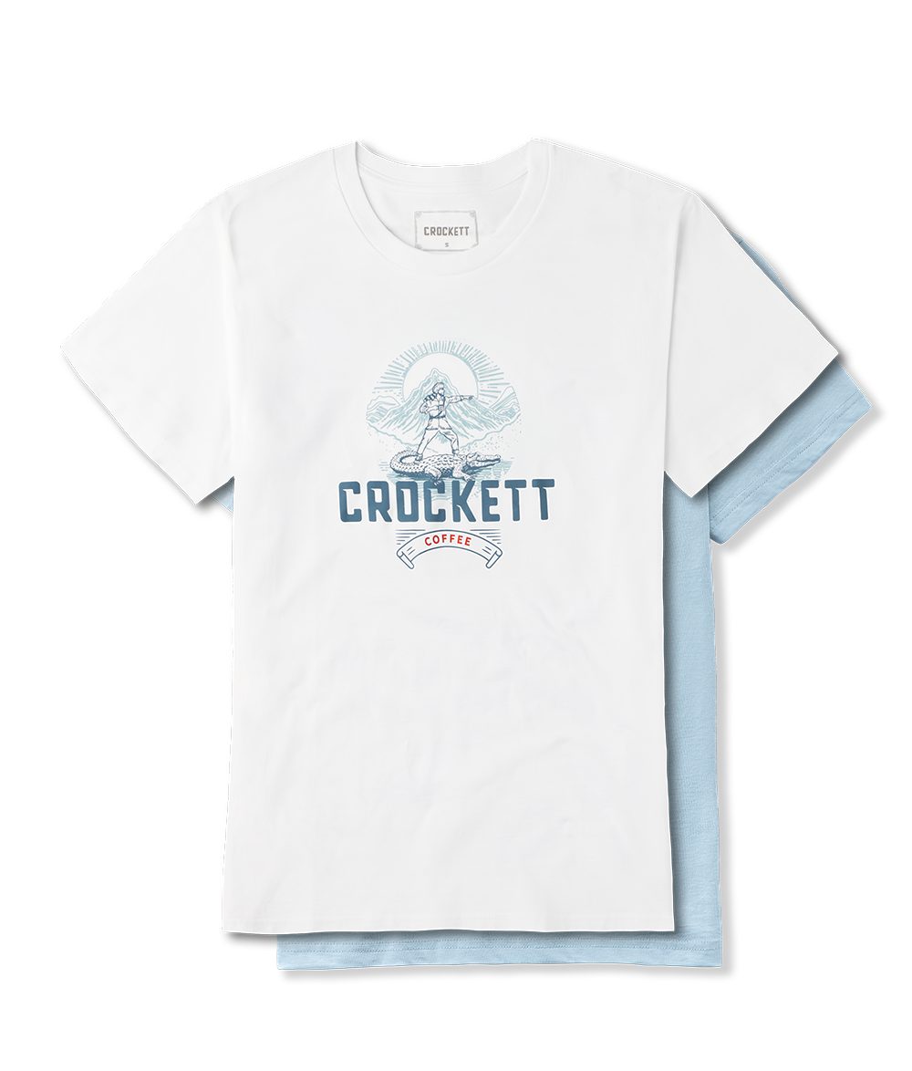 Cotton shirts in white and light blue featuring Crockett Coffee logo with mountain and frontier design.