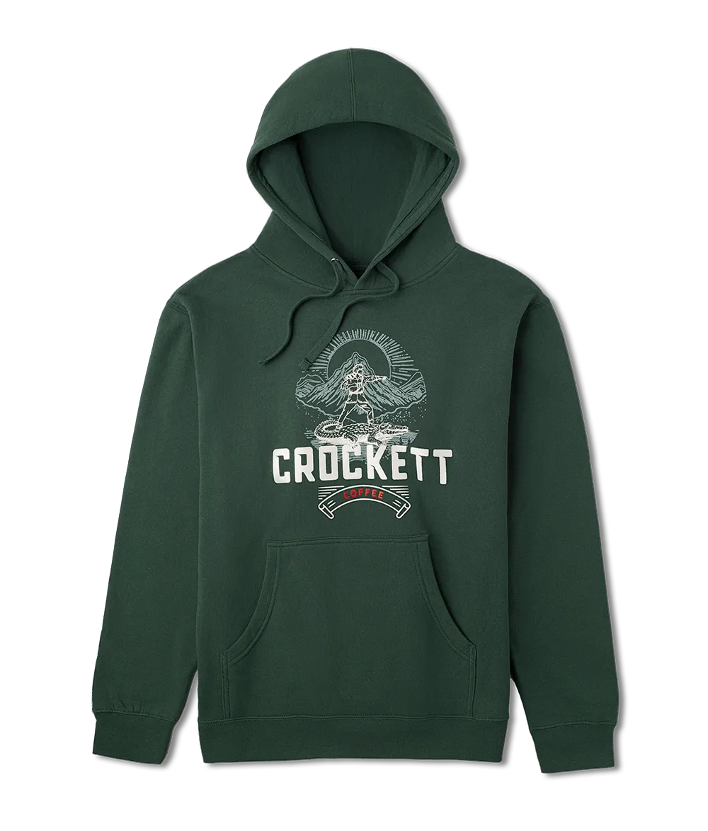 Green hoodie with front pocket and drawstrings featuring Crockett Coffee logo and mountain graphic printed on the chest.