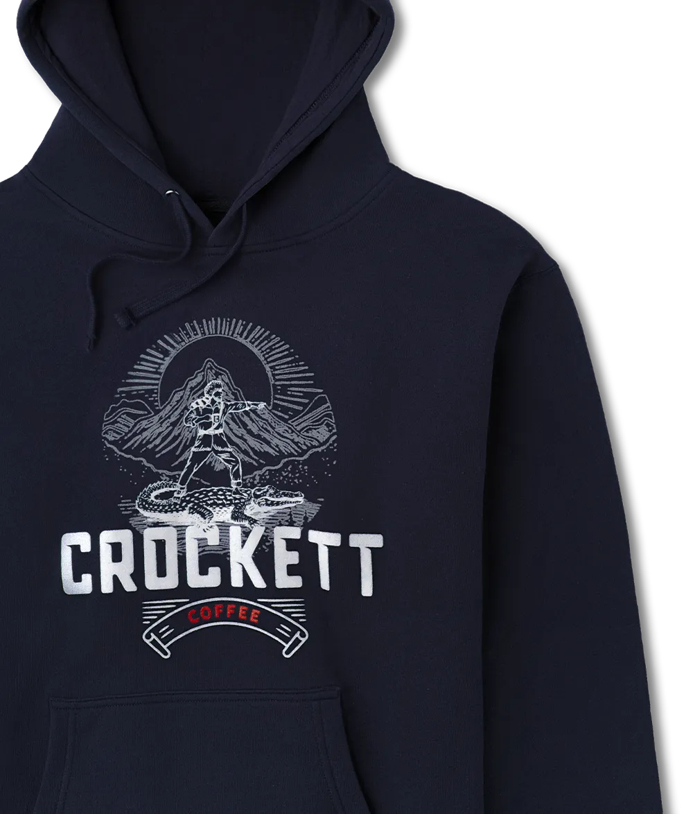 Navy blue hoodie with drawstrings and front pocket featuring a Crockett Coffee logo and mountain graphic on the chest.