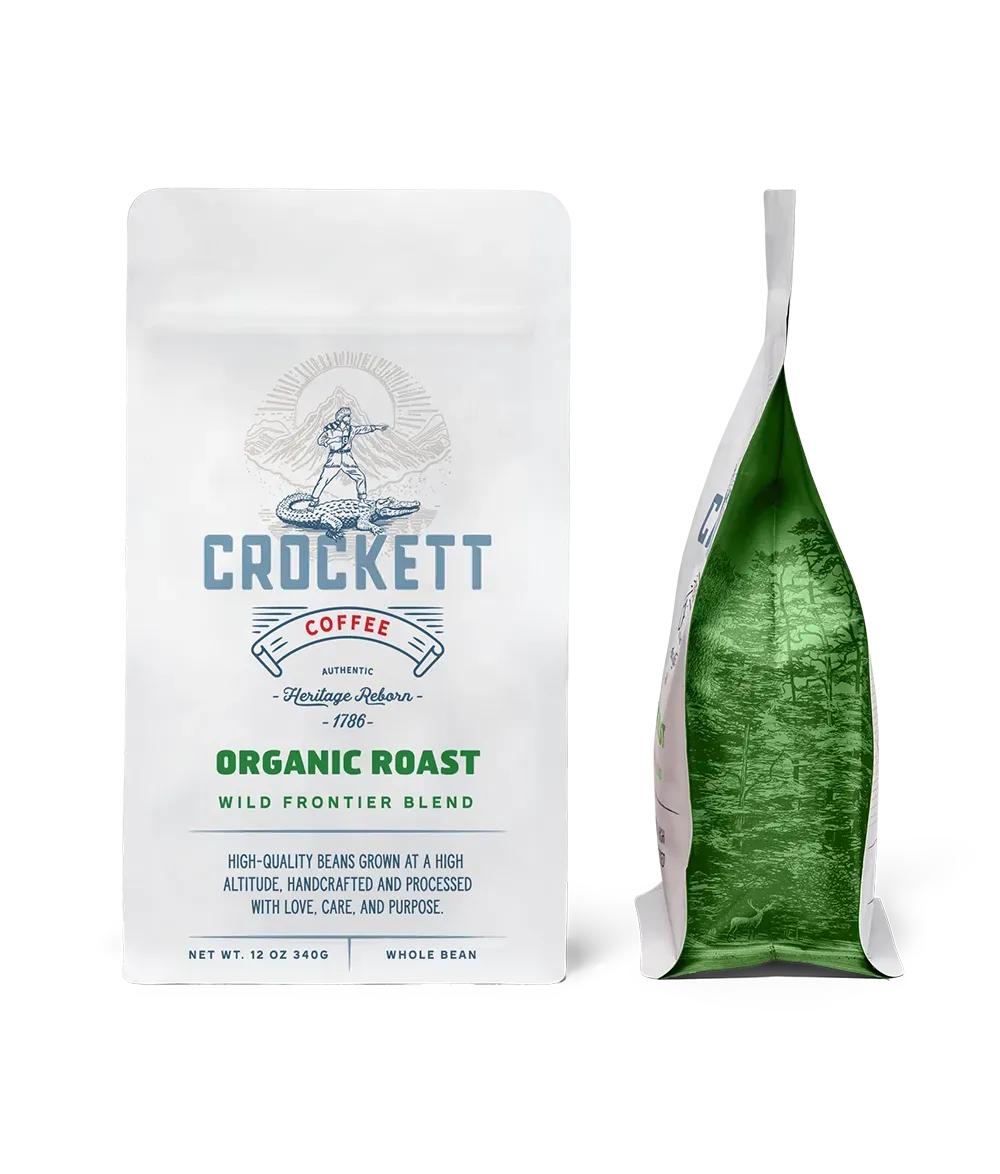 Organic coffee packaging featuring Crockett Coffee's "Organic Roast Wild Frontier Blend" in a white and green bag design.