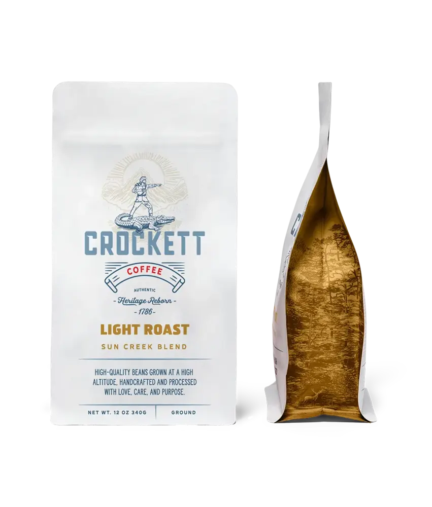 Handcrafted light roast coffee bag labeled “Sun Creek Blend” from Crockett Coffee, featuring premium packaging and golden interior design.