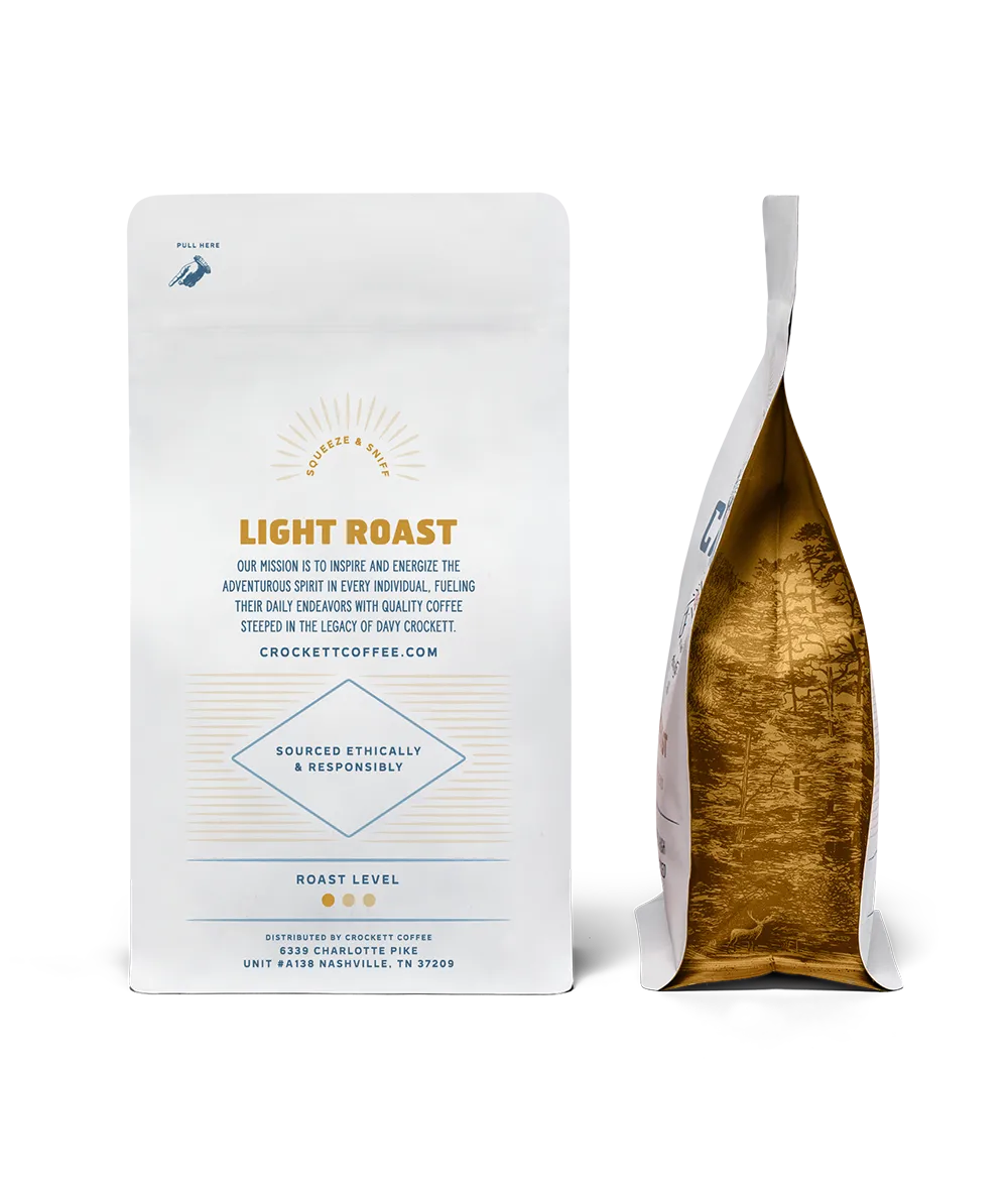 Light roast coffee bag from Crockett Coffee with ethical sourcing details and golden interior packaging design.
