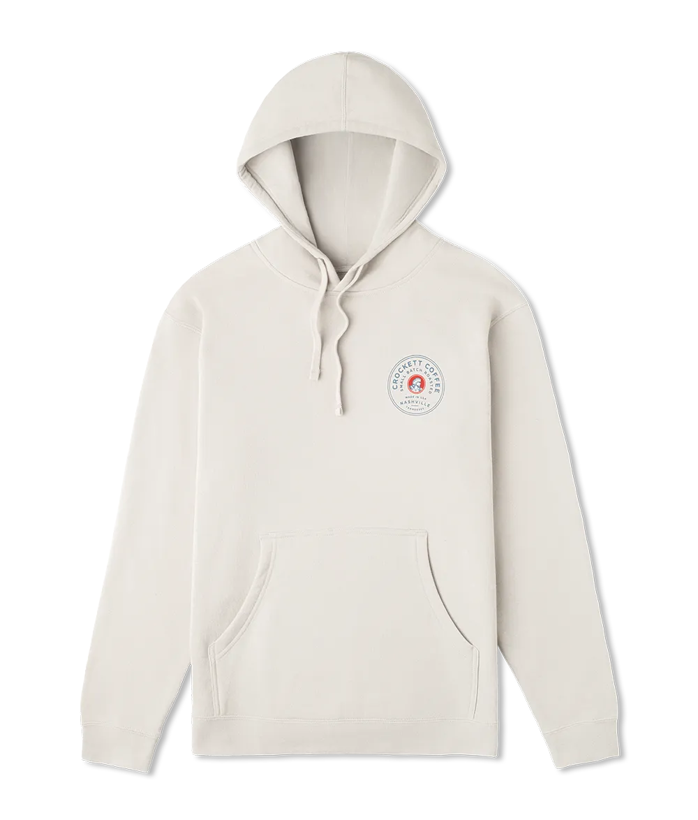 White hoodie with front pocket and Crockett Coffee circular logo printed on the left chest.