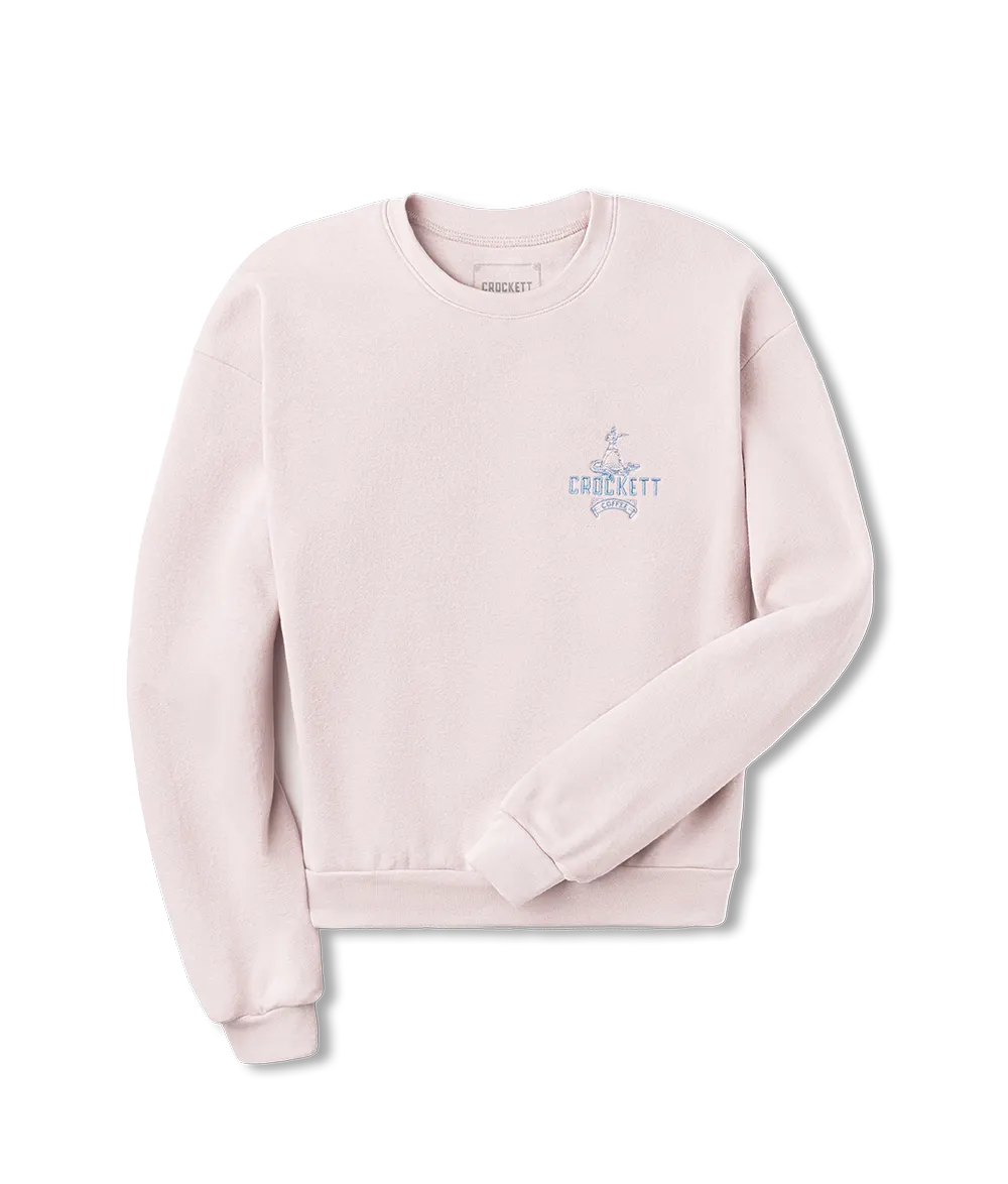 Light pink sweatshirt with blue embroidered Crockett Coffee logo on the left chest and classic crewneck design.